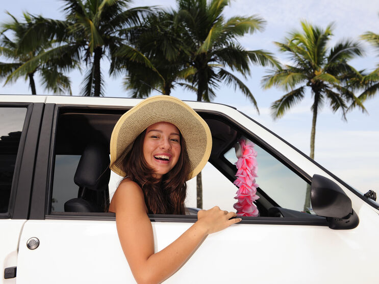 car-rental_-happy-woman-on-summer-vacation-104459324_3866x2577