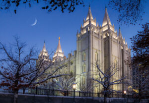 Early evening with a crescent moon over the Mormon Temple in downtown Salt Lake City Utah in wintertime